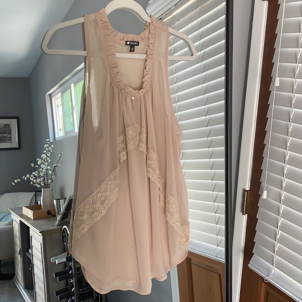 Lily White size medium top with ruffle and lace detail.